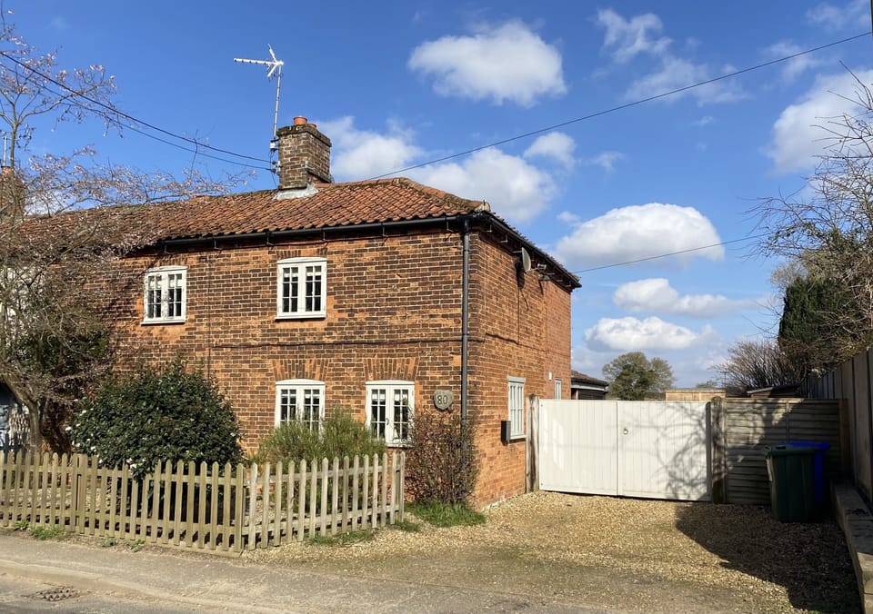 Red Brick Cottage. There are 2 off road parking spaces to the side. 
