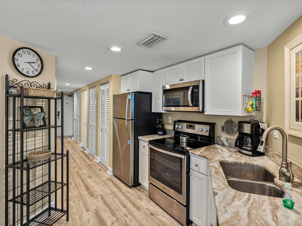 Kitchen & Hallway View . You will love it here as we do !!