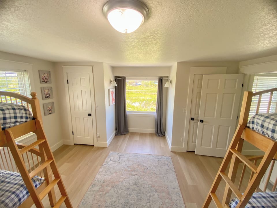 4 twins as 2 bunkbeds and closets.  Great views over the property.