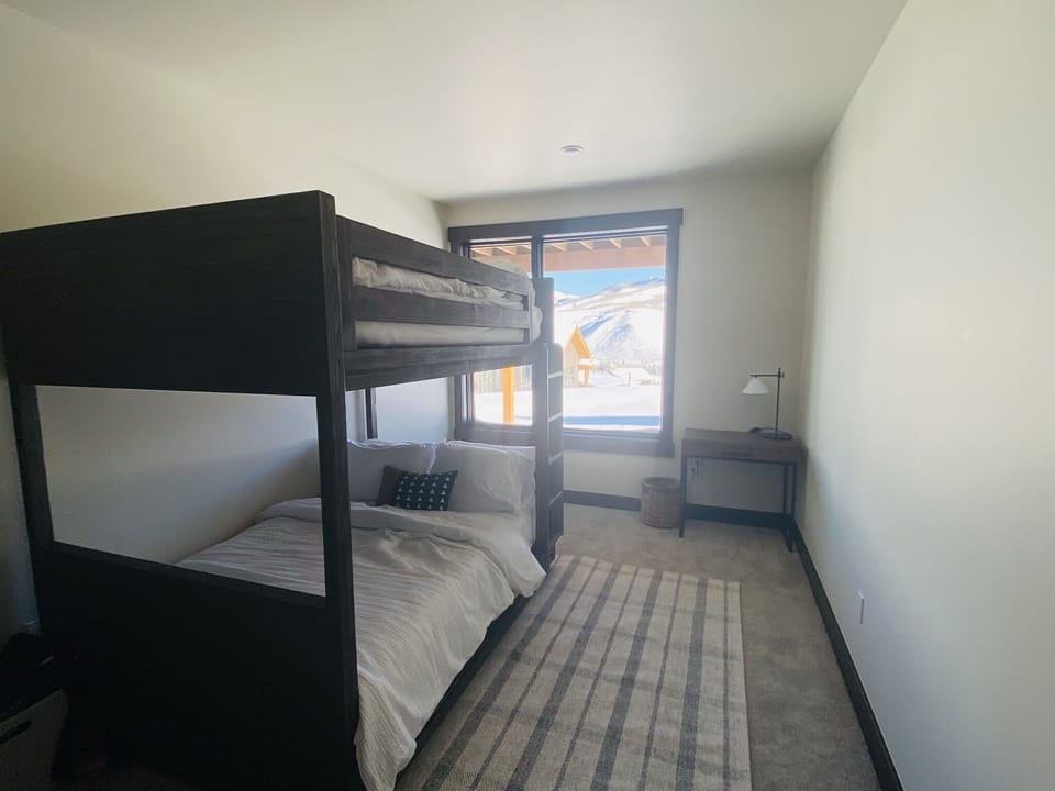 Full on full bunk room with automatic blackout blinds and desk 