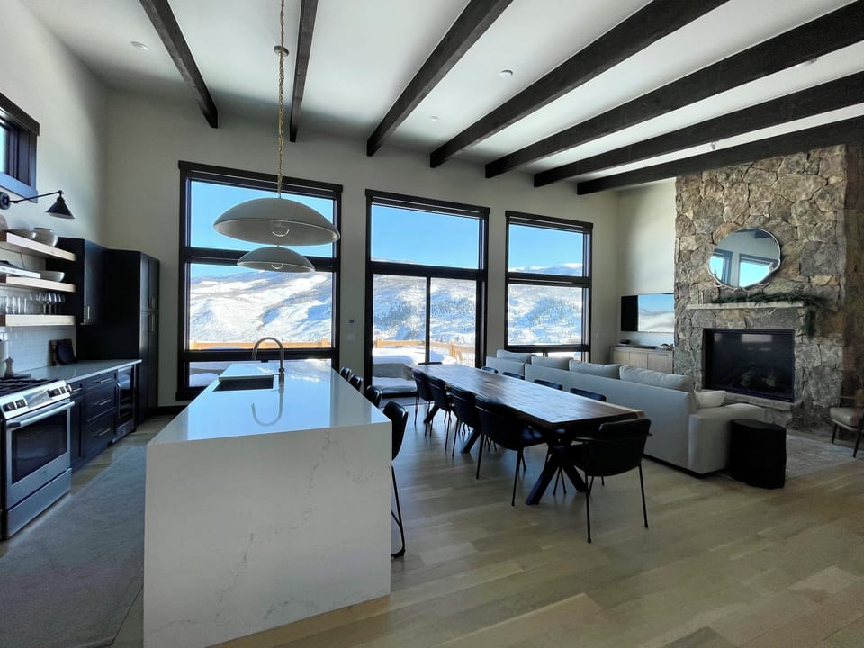 Surround yourself with panoramic mountain views. Custom dining table seats 10.