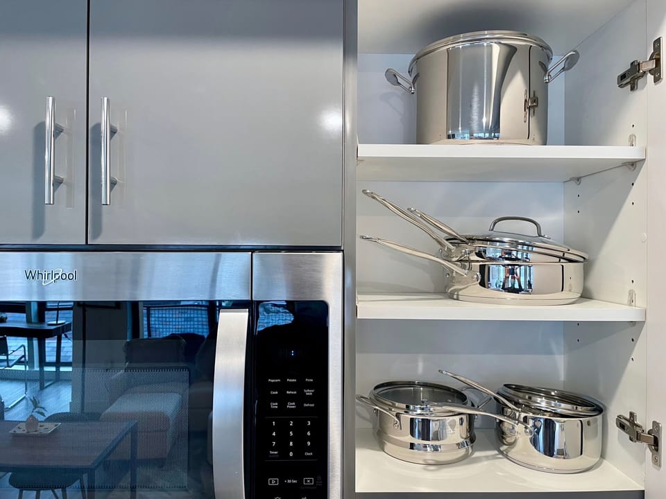 Well ventilated microwave and complete utensils for your kitchen needs