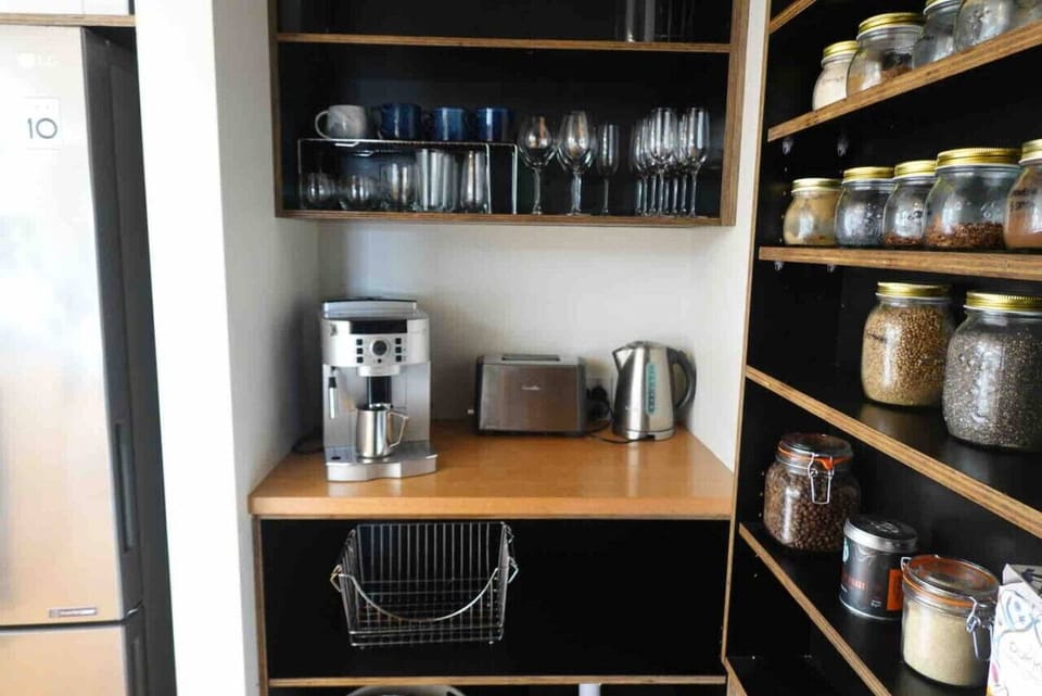 Butlers pantry with espresso machine and selection of spices