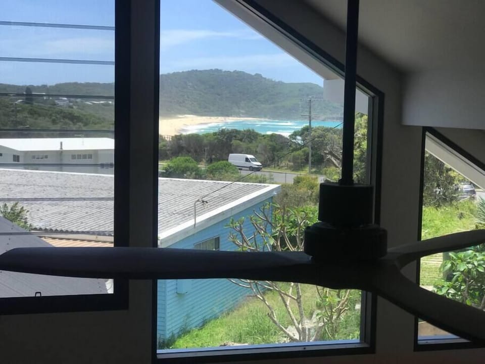 Boomerang beach views from the loft area with king size bed .