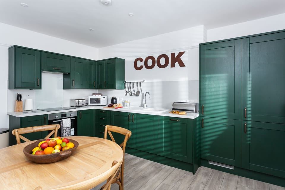 Spacious, fully-equipped kitchen with dining table seating four guests