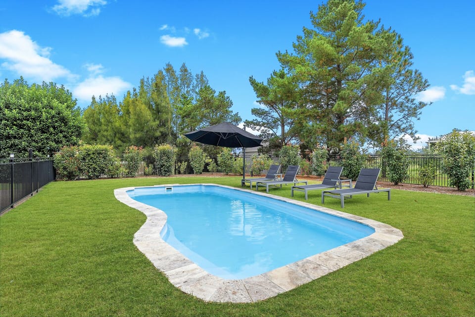 Relax In our beautiful in ground pool .
