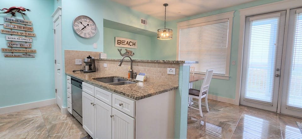Equipped with double sink and dishwasher.