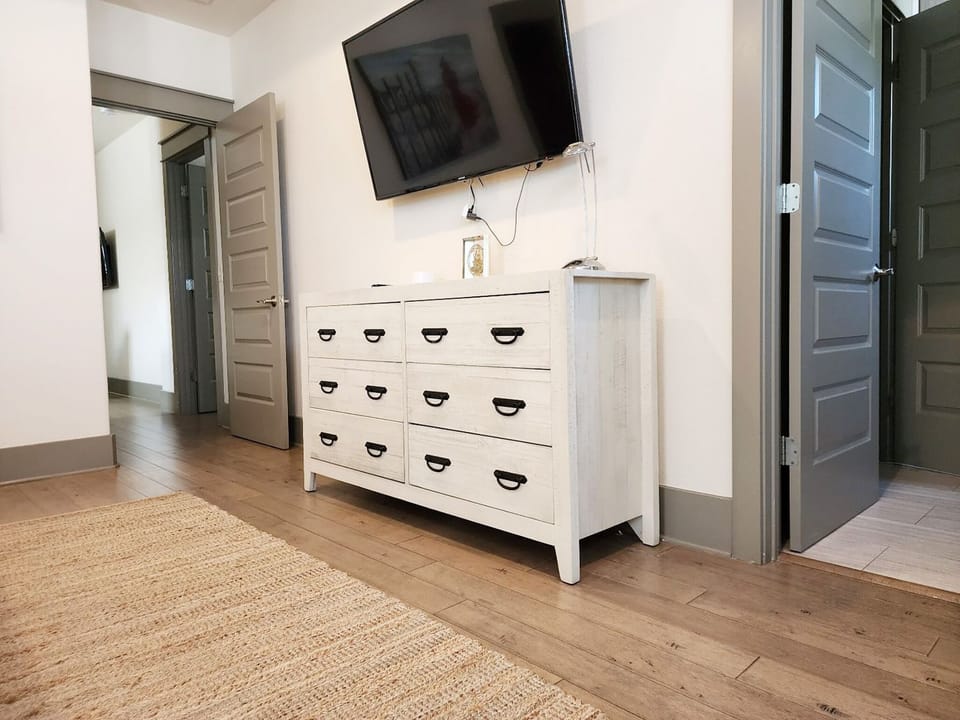 Master with large flat screen TV