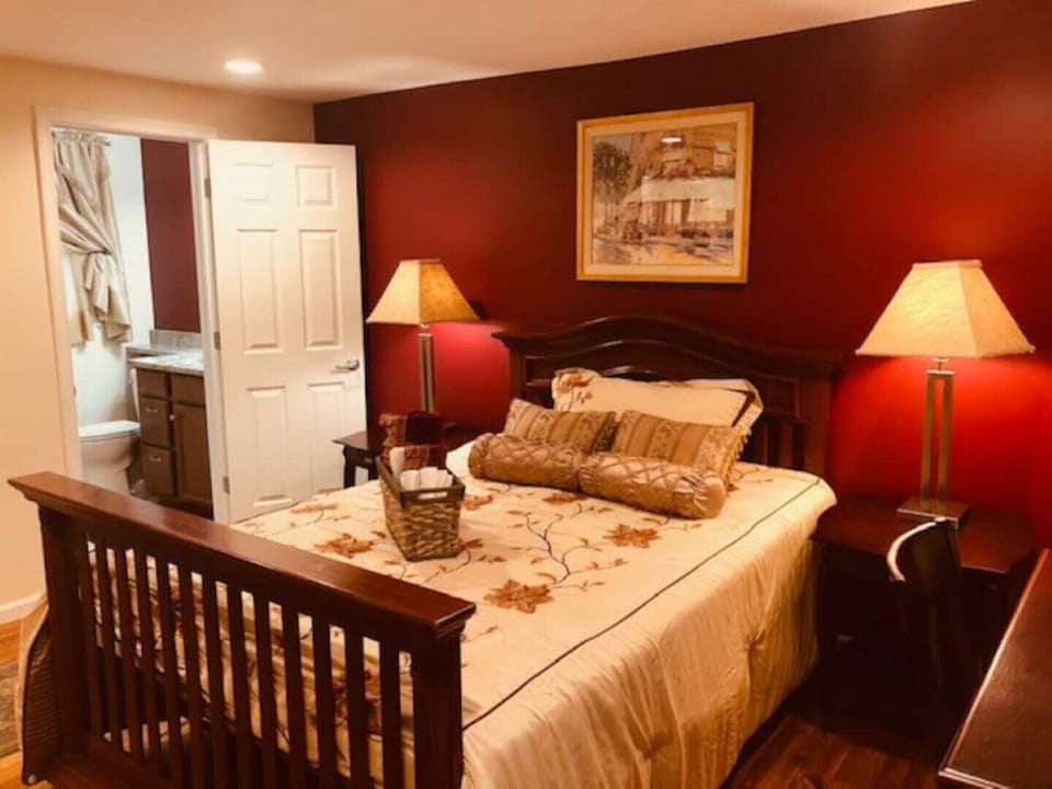 Queen sized bed with attached bathroom with lovely glass tiled walk in shower. 