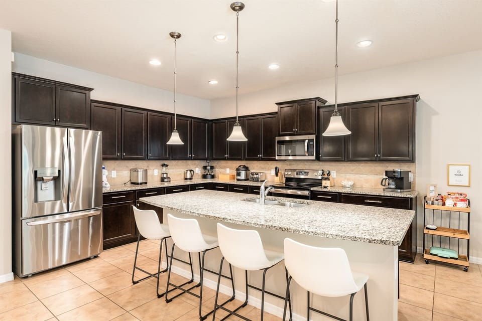 The kitchen has multiple workspaces to accommodate all of the "cooks"