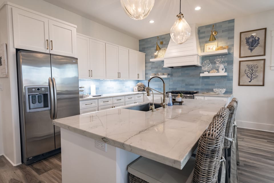Fully stocked kitchen w/ stainless appliances & reverse osmosis water spout.