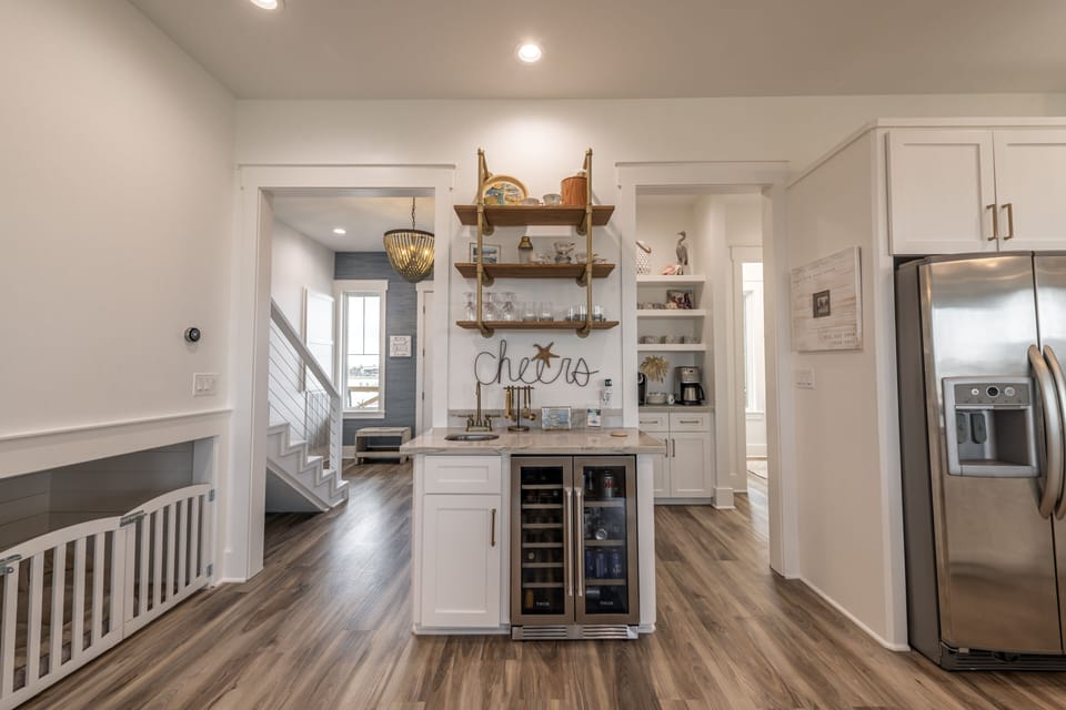 Beverage center including wine/beer/soda fridge.  Small bar sink.
