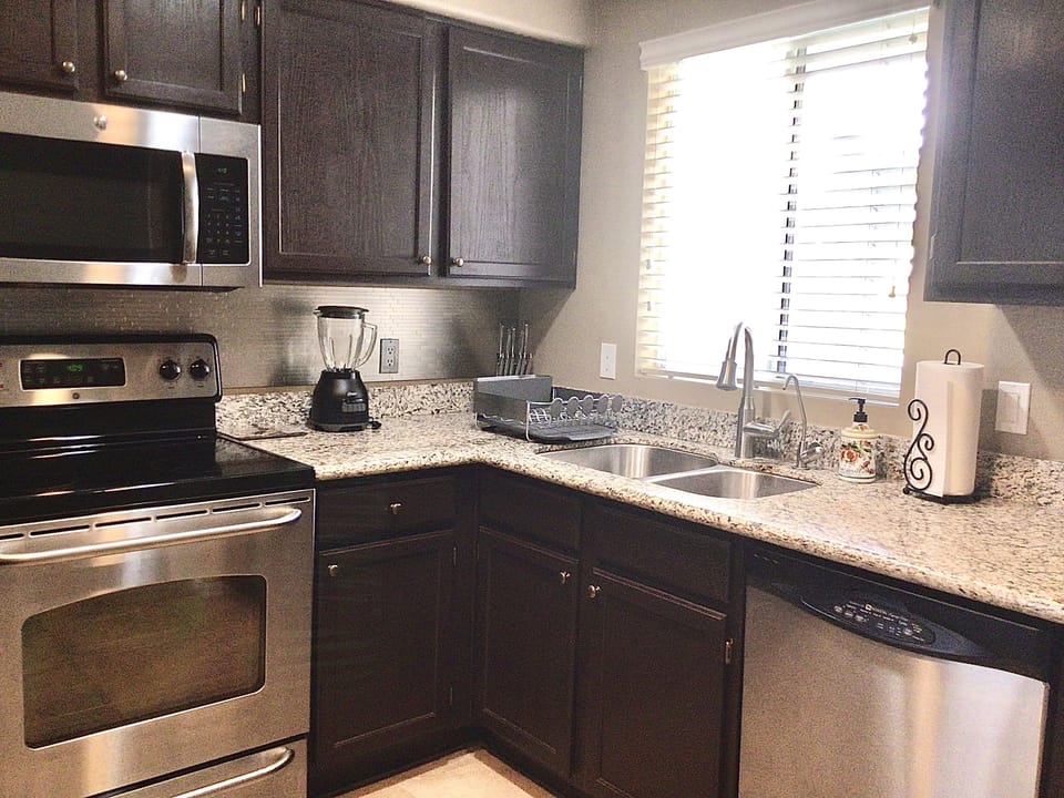 Equipped kitchen with refrigerator, electric stove, oven, microwave, dishwasher