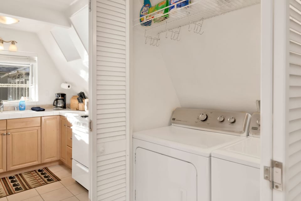 Convenient on-site laundry nook with washer and dryer, making longer stays easy and comfortable—perfect for refreshing clothes after mountain adventures or extended Airbnb getaways.