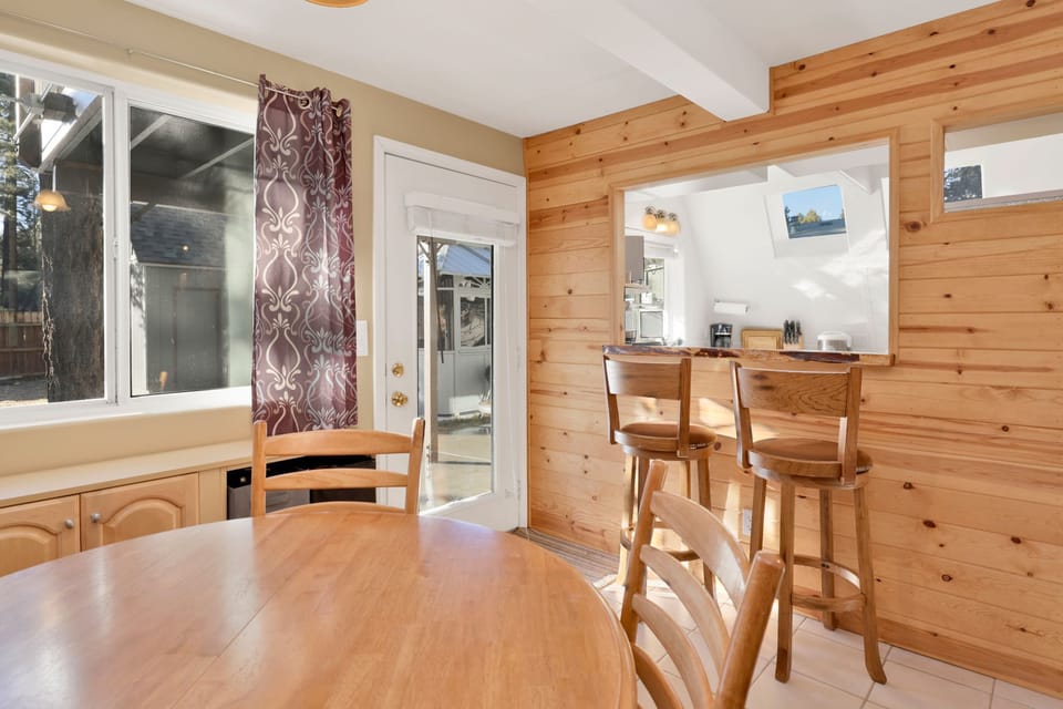 Fully equipped cabin kitchen with ample cabinetry, stove, fridge, microwave, and coffee maker—perfect for cooking meals, morning coffee, and feeling right at home on your stay.