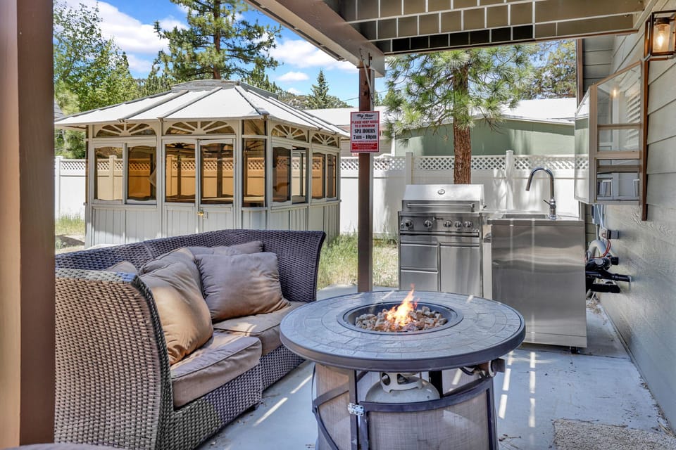 Private outdoor hot tub surrounded by tall pines, perfect for relaxing under the trees after a day of adventure—enjoy peaceful forest views, fresh air, and a truly rejuvenating stay.