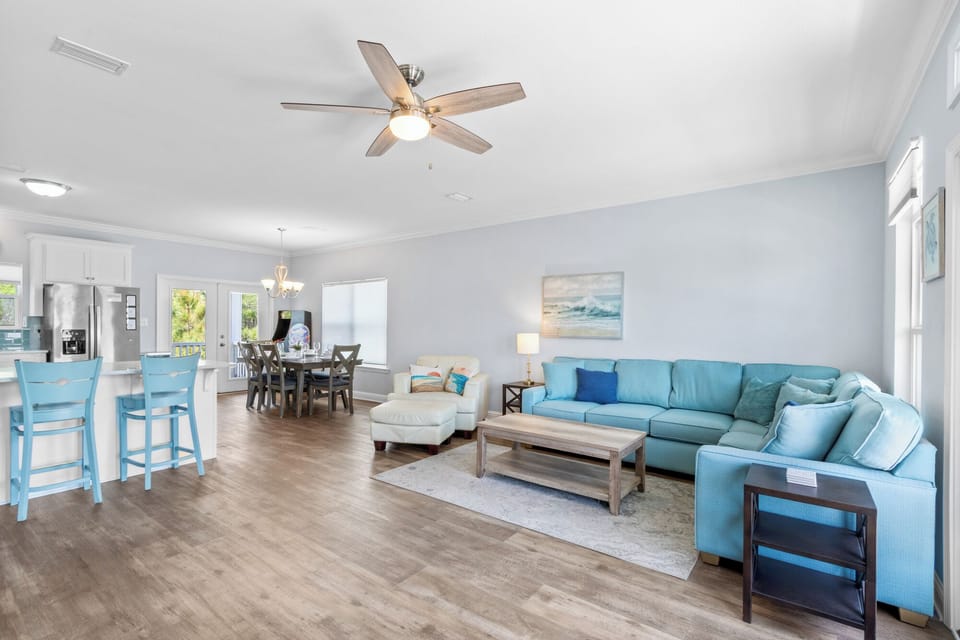 Open-concept living room offers comfortable and ample seating for your group