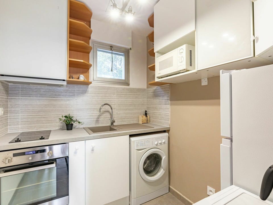 Cabinetry, Property, Sink, Laundry Room, Tap, Kitchen Sink, Countertop, Building, Kitchen Stove, Kitchen