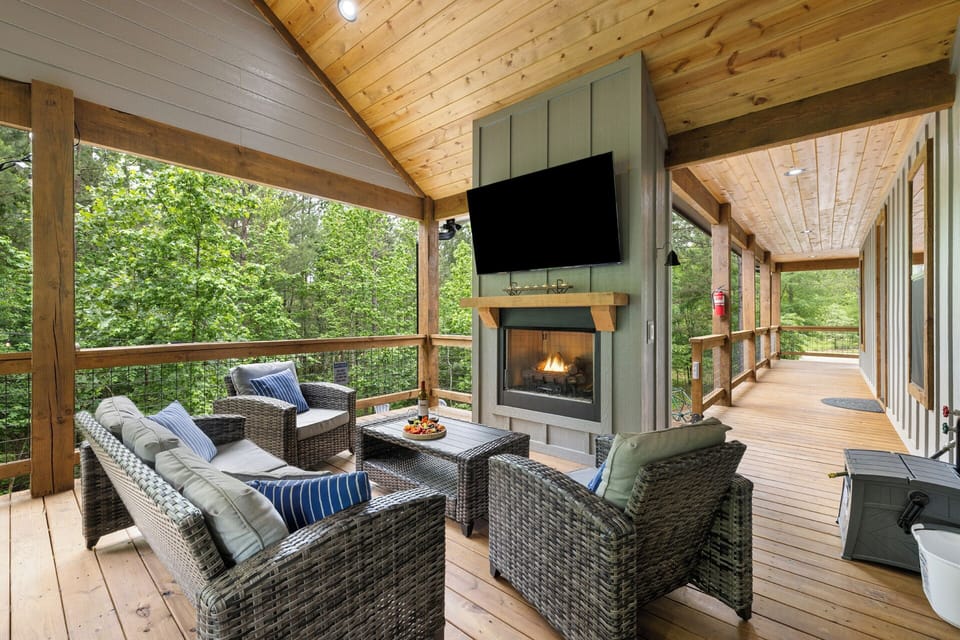 Relax and unwind on the spacious deck, complete with a seasonal gas fireplace (October 1 - March 31), TV, and cozy outdoor couch—perfect for any time of year. 