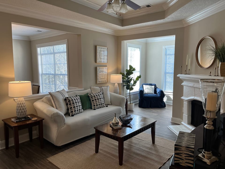 Spacious Living Rm with Fireplace and Sunroom with Built-in Desk area