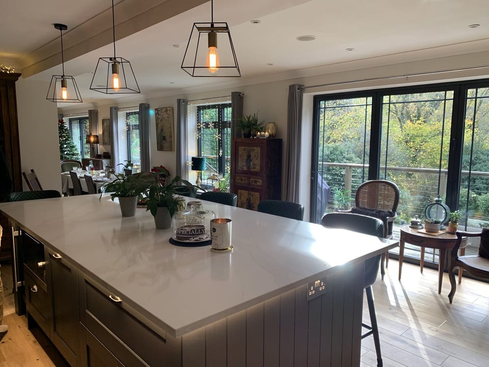 Large open plan kitchen with bifolds overlooking Whitmore Vale