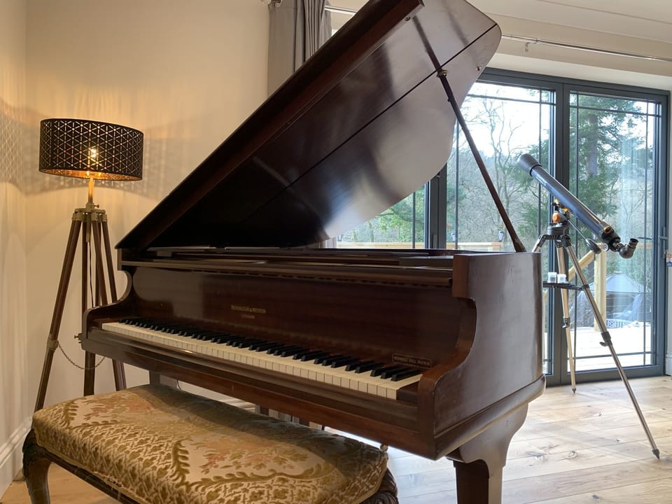 Mornington & Weston baby grand piano and telescope.