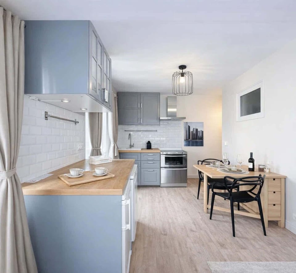 Open well equipped kitchen with a dining table & seating
