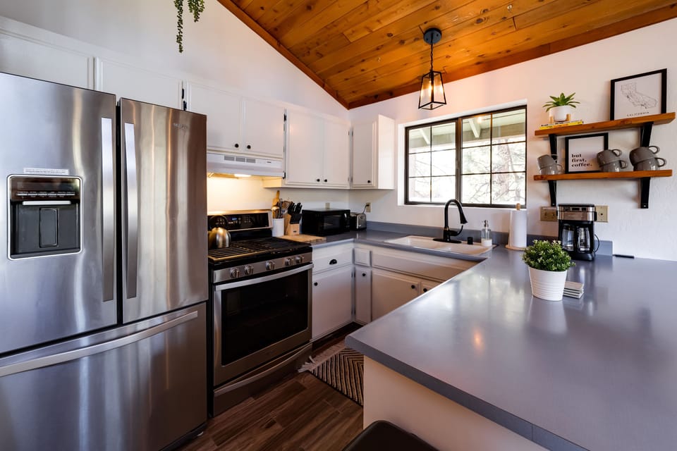 Fully-equipped kitchen includes coffee station, tea, utensils, cookware, etc.