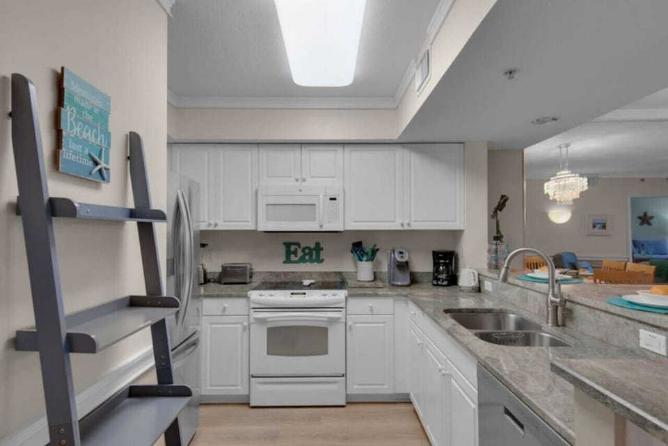 Kitchen is well stocked with appliances and dishware for 8