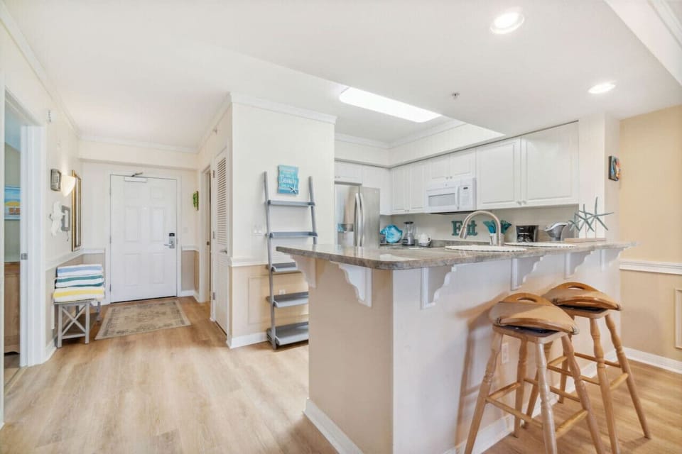 Entry to Kitchen with a few seats at the bar