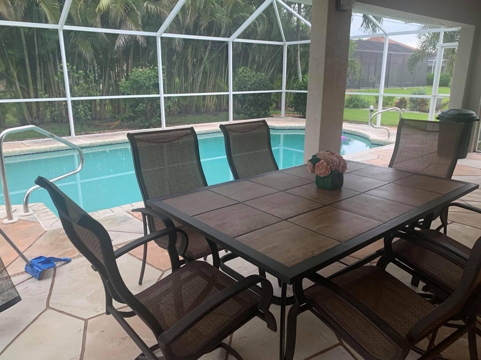 Outdoor patio by poolside. 