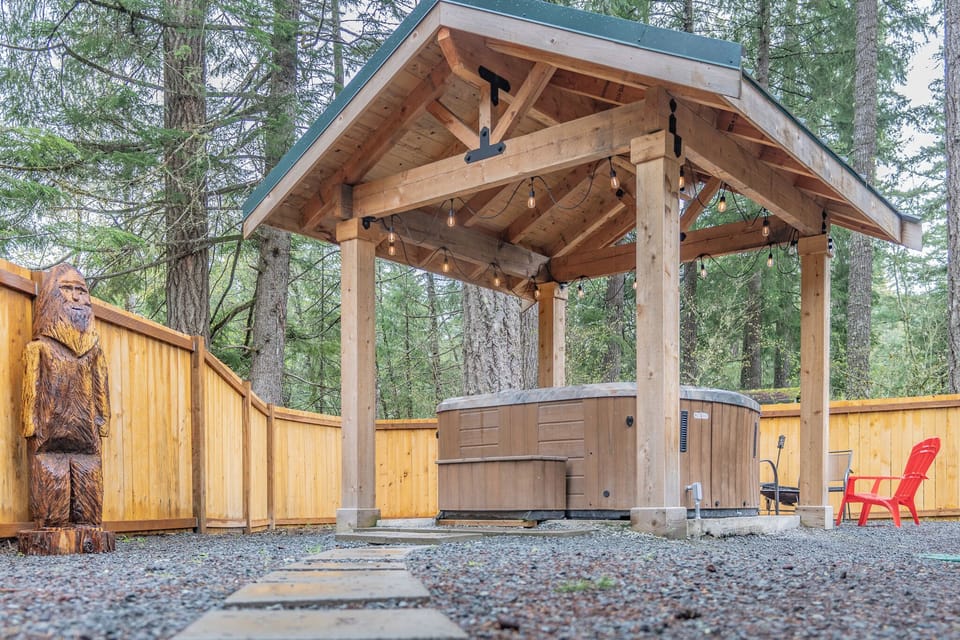Soak in the covered hot tub, relaxing in comfort no matter the weather.
