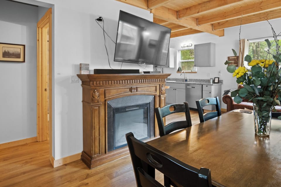 Gather at the dining table for 6, perfect for meals and cozy moments by the fire