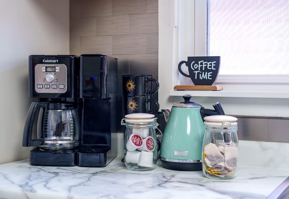 Drip & single cup coffee maker, grinder, tea & kettle.  We have it all!