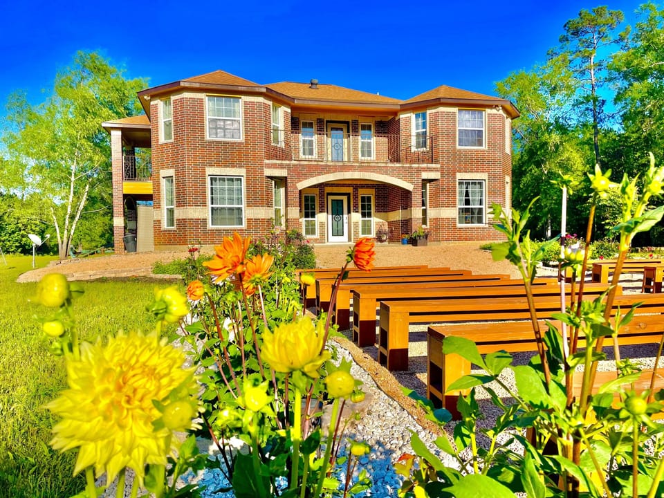 Beautiful flower gardens make the yard bright all year around.