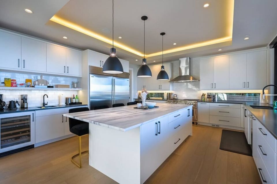 Spacious kitchen w/ wine fridge, double stock/oven, double refrigerator, plenty of counter space and more.