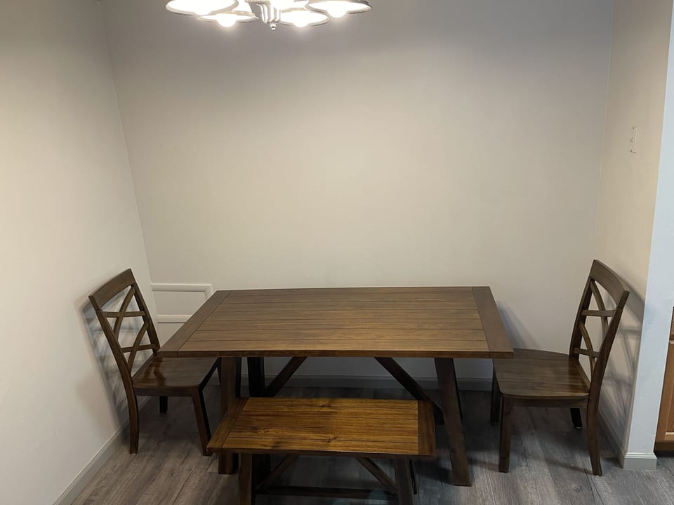 Dining table with currently room for 4. More chairs will be added soon.