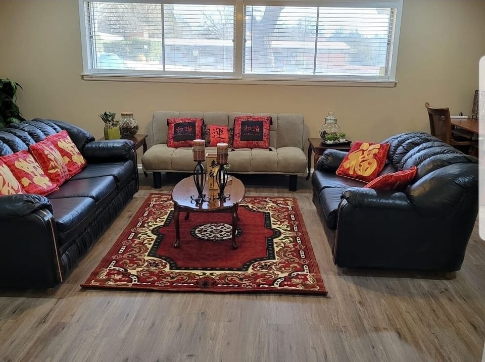 Living area w/ sofa, loveseat and futon (extend futon for extra sleeping space)