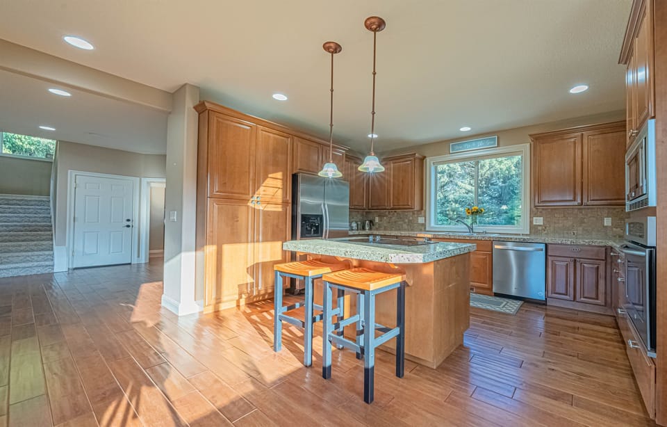 Modern kitchen with stainless steel appliance.