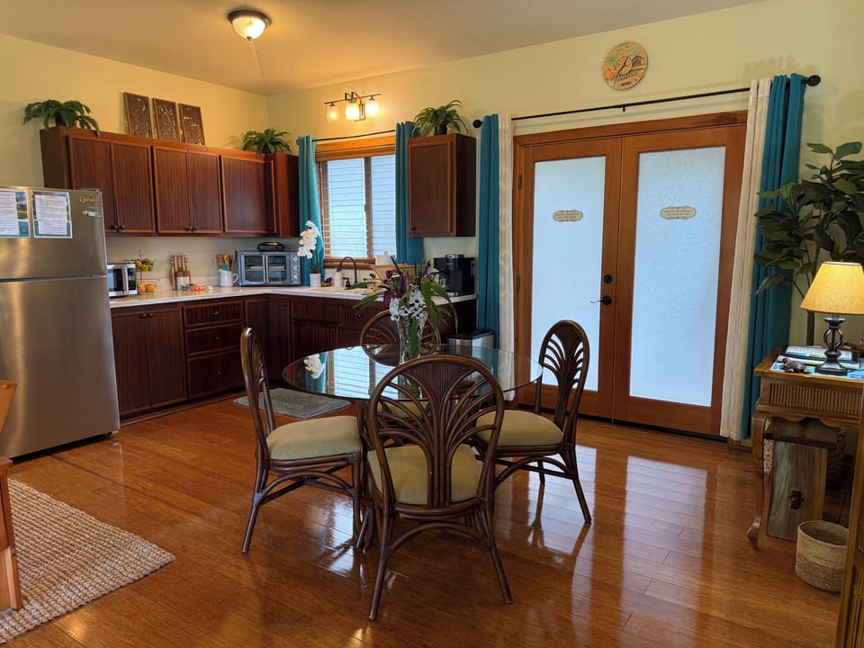 View of kitchen and dining space.  Small desk area to the right.  
