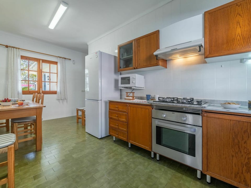 Furniture, Cabinetry, Property, Building, Countertop, Kitchen Stove, Table, Kitchen Appliance, Window, Wood