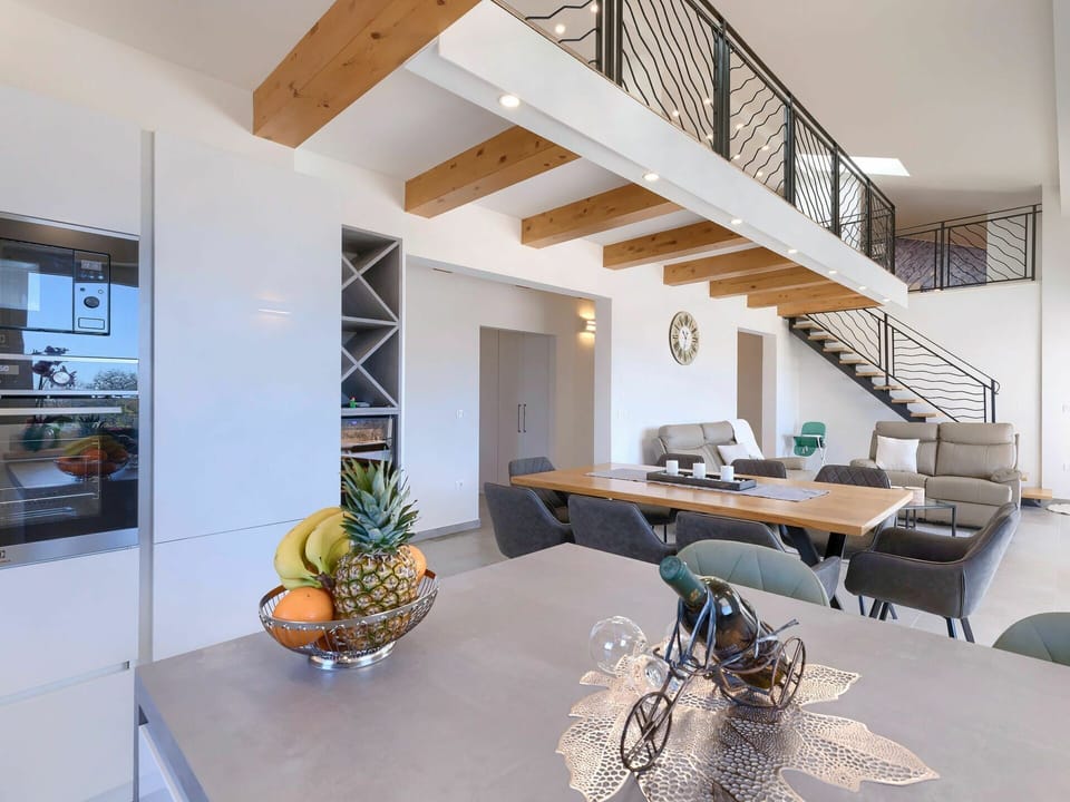 Table, Furniture, Property, Building, Wood, Tableware, Interior Design, Lighting, Houseplant, Architecture