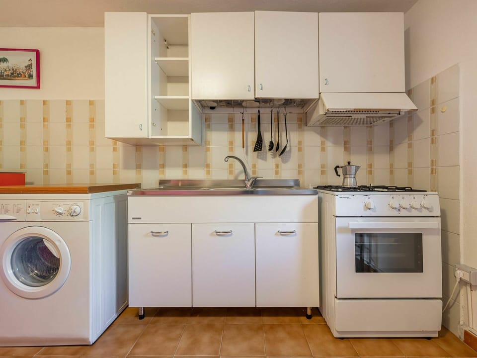 Cabinetry, Laundry Room, Countertop, Kitchen Sink, Building, Kitchen Stove, Kitchen Appliance, Sink, Kitchen, Home Appliance