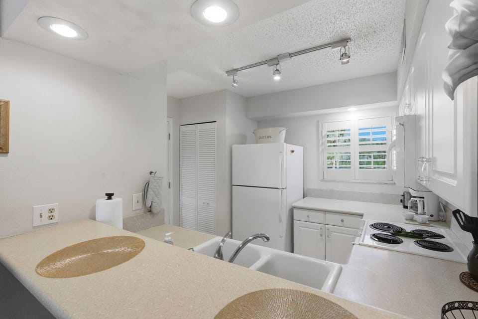 Bright coastal kitchen with breakfast bar seating
