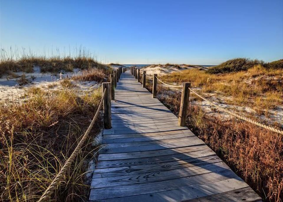 Boardwalk to the Beach - A nice boardwalk leads you to the beach for convenience, and to keep guests from harming the dunes.