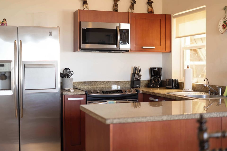 The granite countertops & stainless steel appliances make for a great home-cooked meal