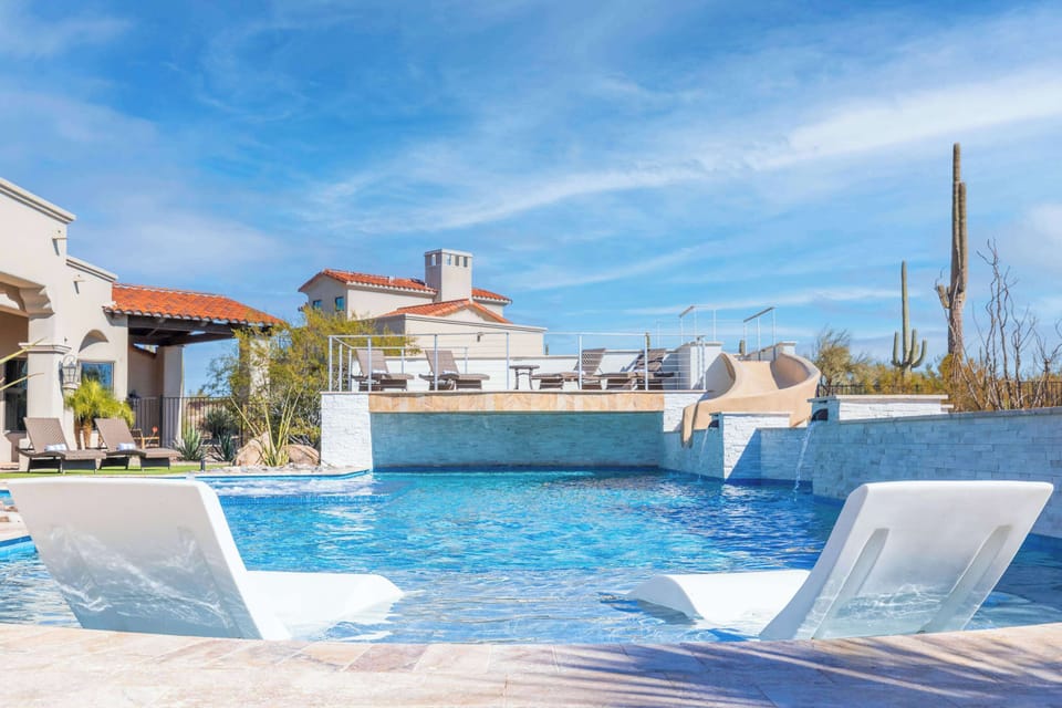 Crystal-clear waters, built-in spa jets, and a exhilarating water slide