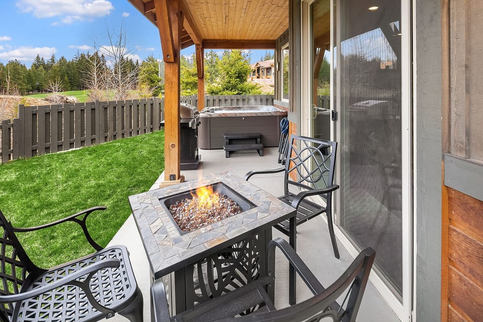 The Getaway: - Fire pit table on the back deck.
