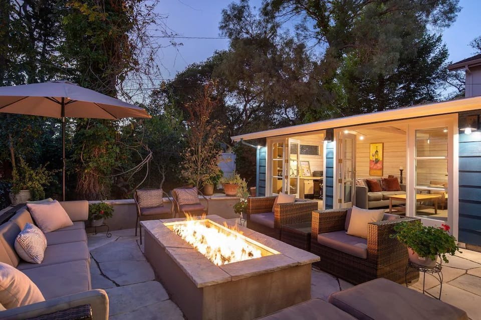 Evening in the private courtyard, doors open for an indoor/outdoor lifestyle