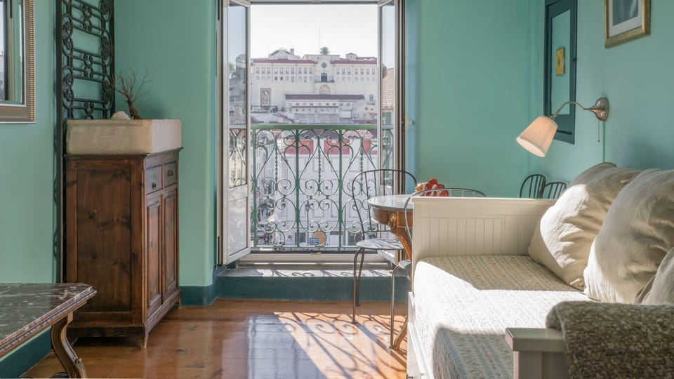 Relax in a sun-filled living space with elegant vintage touches and direct access to a Juliet balcony overlooking the heart of Lisbon. #LisbonLiving #CityEscape #HistoricCenter #BoutiqueStay #Portugal #PT #Lisbon